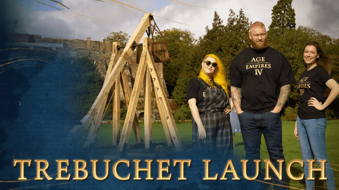 Actor Hafþór Júlíus Björnsson stands with MangoMel and Charleyy in front of a trebuchet. Title reads "Trebuchet Launch"